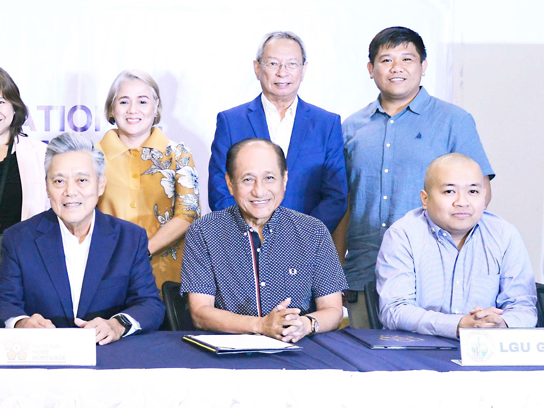 Done deal Signing or witnessing the signing of the memorandum of agreement to build more socialized housing in Isabela were (seated, from left) National Home Mortgage Finance Corporation president Renato L. Tobias, former Isabela Governor Faustino Dy Jr., DHSUD Assistant Secretary Daryl Bryan Villanueva, and (standing, from left) NHMFC EVP OLivia Alicia Ramos, NHMFC consultant Joel Macalincag, and Uanjelle Land Inc. president Engr. Alduane Alegria.